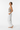 Swimsuit with white linen beach pants