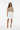 T-shirt with white tailored shorts and heels
