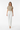 T-shirt with white wide-leg trousers and nude heels