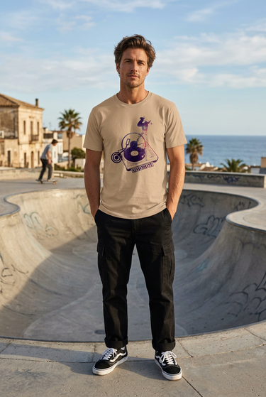 Tan ODDSON tee beside a coastal skate bowl