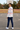 Teen girl showing the white hoodie's back artwork