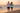 Two models together in a sunset beach fashion editorial