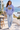 Violet hoodie with light-wash jeans on a female model