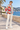 Wavy-blond model on a seaside promenade