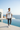 White graphic tee and joggers at a coastal villa