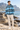 White male model wearing the African Origins blue windbreaker on a Cape Town-inspired coast