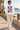 White Surfxion sweatshirt on a seaside promenade