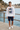 White sweatshirt with navy shorts