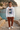 White sweatshirt with rust chinos