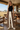 Wide-leg pants editorial in a safari lodge lounge