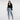 Woman in Jaguar Blue leopard print joggers with black blazer and heels
