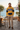 Yellow and navy hoodie styled with sand chinos at a seaside café