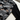 Angular pattern and solid black sleeve close-up
