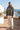 Asphalt hoodie with linen trousers on a Mediterranean terrace