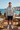 Athletic Heather hoodie with navy shorts at a coastal café