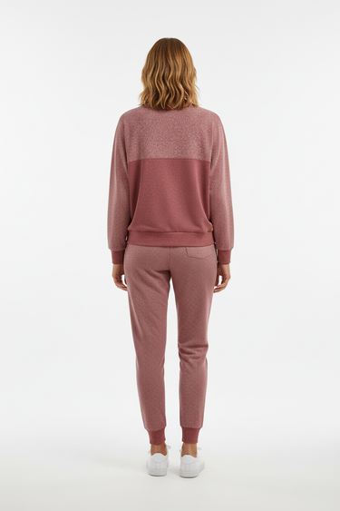Back studio view of the female model wearing the matching rose set