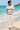 Barefoot beach look with cream linen trousers