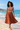 Barefoot beach walk in the terracotta geometric midi dress