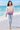Barefoot shoreline look with light-wash jeans