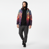 Bearded man in galaxy windbreaker with hood