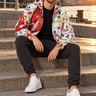 Bearded model seated on harbor steps