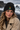 Black beanie on volcanic shore