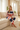 Blonde model relaxing on a sofa in striped joggers