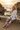 Blonde model, sunset rocky cove