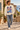 Bone Surfxion sweatshirt in a coastal village