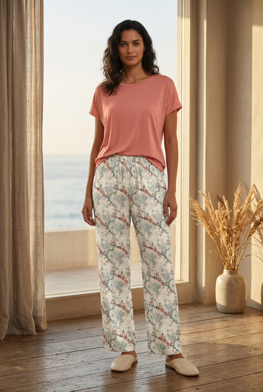 Botanical pajama pants styled with a coral knit top