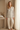 Botanical pajama top styled with ivory trousers