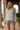 Botanical pajama top styled with sage shorts