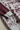 Burgundy sleeve and gray cuff close-up