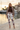 Camo joggers styled with a chocolate knit top and taupe blazer