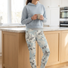 Camo leggings and pale-blue hoodie, kitchen coffee