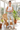Camo leggings and white tank in the sunroom