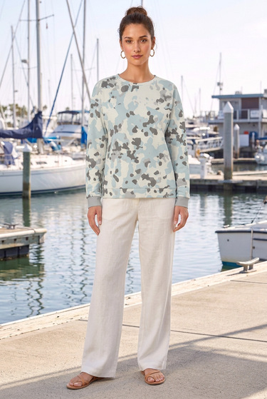 Camo sweater with ivory linen trousers