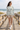 Camo sweater with tailored shorts at the beach