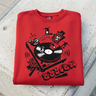 Cardinal sweatshirt artwork and neckline on concrete