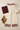 Cream bordered pants styled with a burgundy sweater top