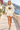Cream hoodie with ivory shorts on a female model