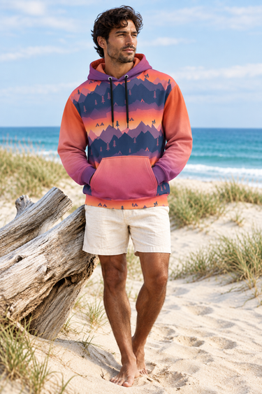 Curly-haired male model in a barefoot beach look with ivory shorts