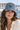 Denim and tan cap close-up