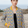 Editorial close-up highlighting yellow cuffs and pockets