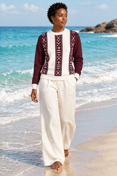 Female barefoot beach look with cream linen trousers