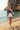 Female beach editorial with denim shorts