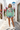 Female editorial with light-wash jean shorts
