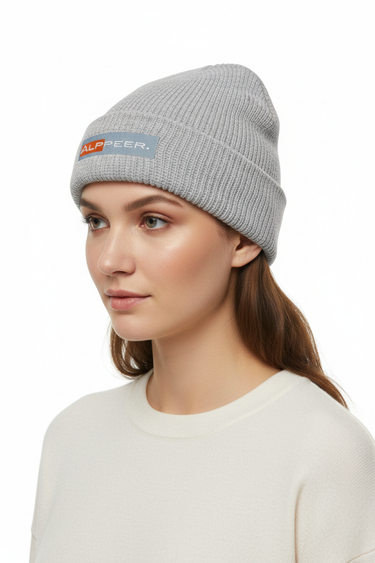 Female model close-up wearing athletic heather beanie looking to side