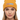 Female model close-up wearing gold beanie