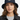Female model close-up wearing navy bucket hat